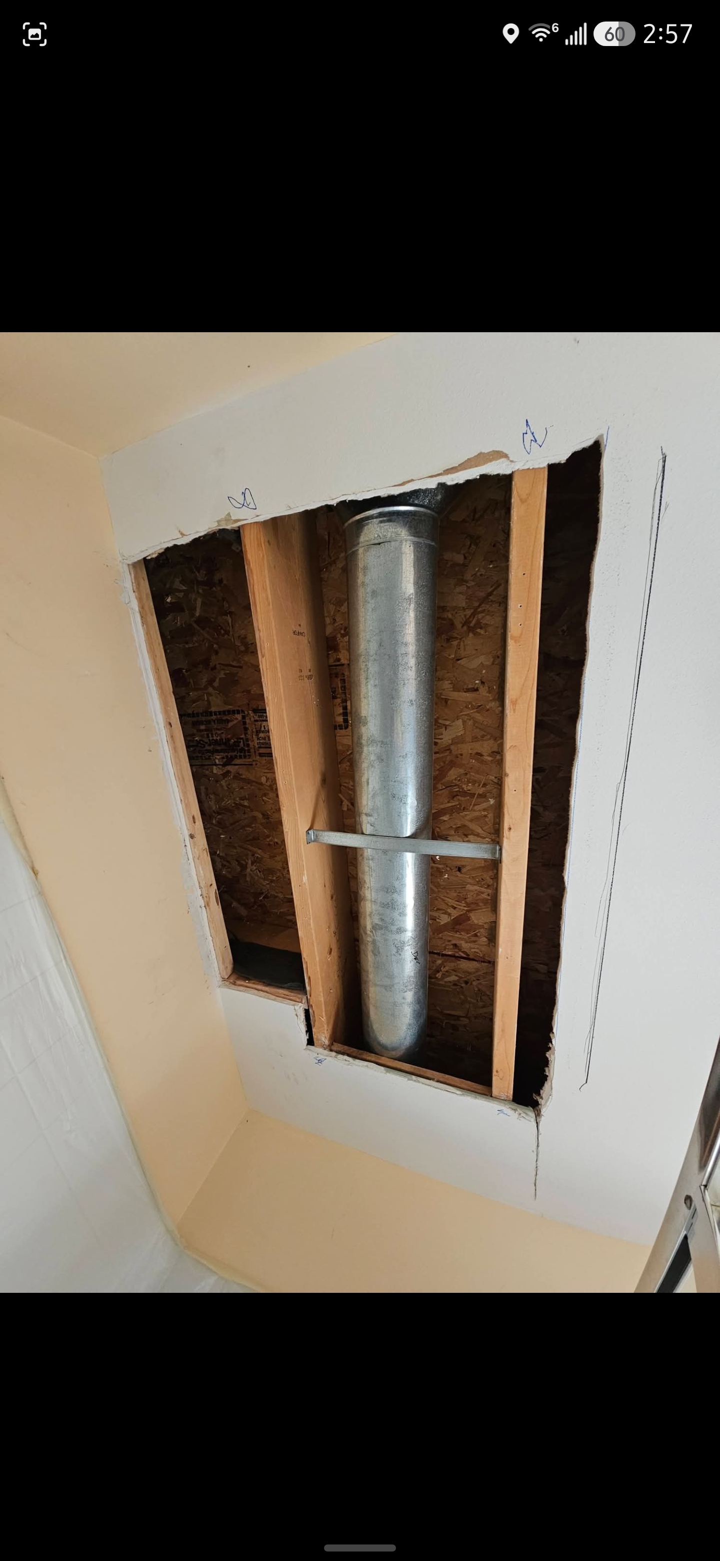 Damaged wall structural framing open area before repair